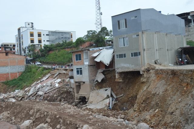Bad table design reflected using Severely damaged urban buildings after a landslide in Mocoa, Colombia, showcasing destruction